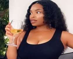 Shirley B Eniang consuming alcohol
